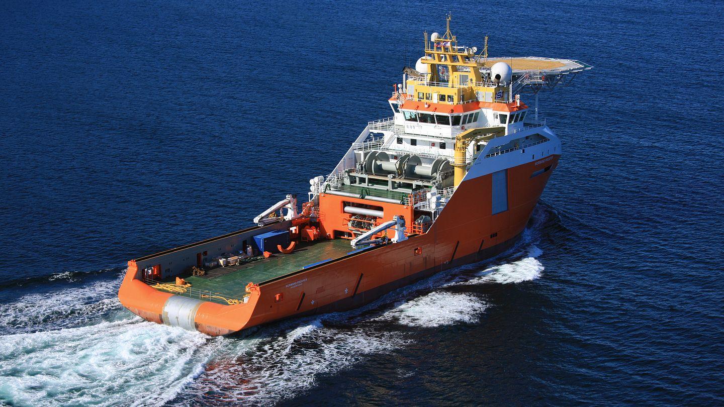 Offshore support vessel underway at sea.